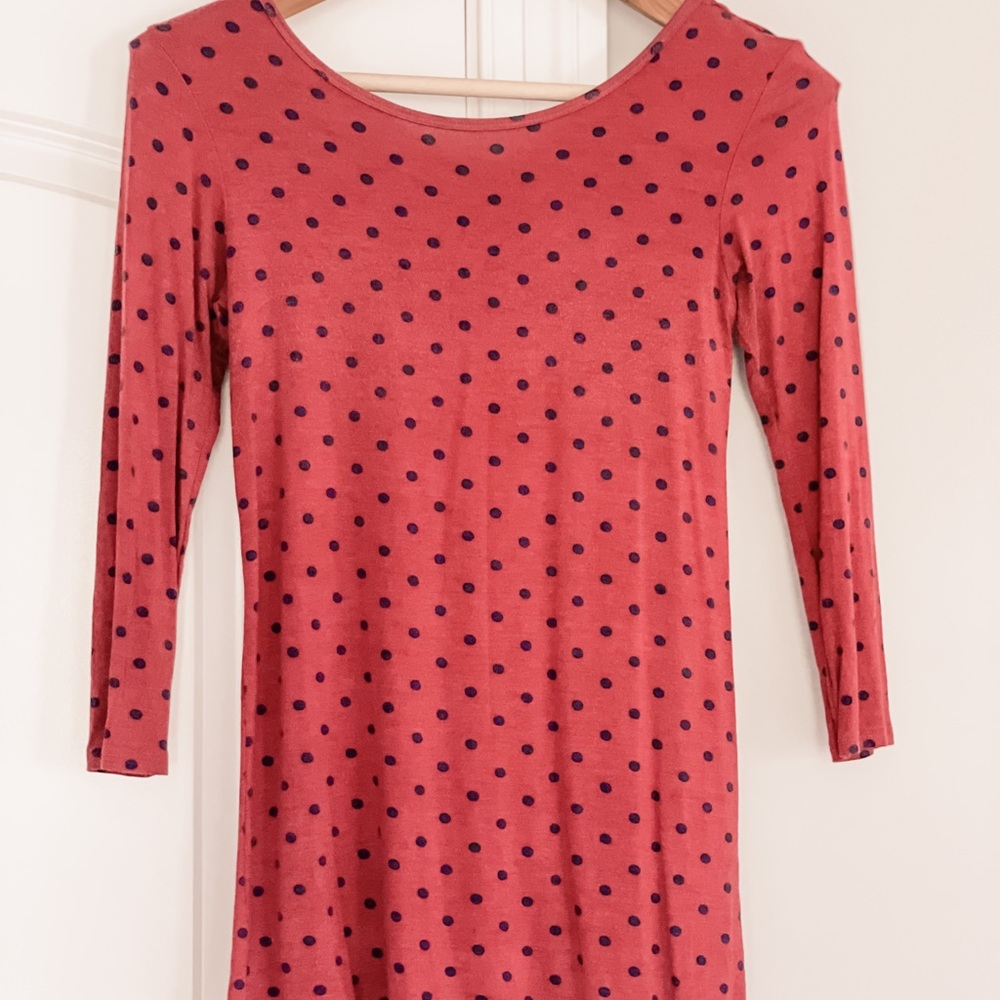Sweater. Deep red with navy blue dots. Cross detail in back.